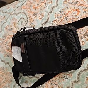 Fabric: Ballistic weaveKey clip and TUMI Tracer® tagZip closureWelt front pouch.